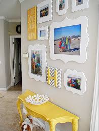 5 photo frames on wall arrangement. Helpful Hints For Displaying Family Photos On Your Walls