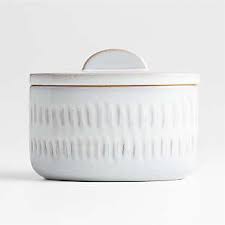 For dry baking ingredients, a set with a chalkboard decal reveals what's inside, from white or brown sugar to cornmeal and flour. White Kitchen Canisters Crate And Barrel