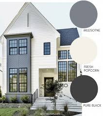 A Modern Farmhouse Exterior With Light Beige Paint And Grey Accents Farmhousei Exterior Paint Colors For House Modern Farmhouse Exterior House Paint Exterior