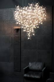 sculptural chandeliers accented with real dandelion seeds lights home lighting lighting inspiration
