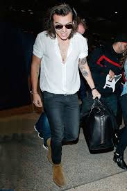 Styles did a good job of playing it cool throughout the game (that's in every rocker's job description after all) but his heart deceived him when presented with two. Harry Styles Wearing Black Blazer White Short Sleeve Shirt Navy Skinny Jeans Brown Suede Chelsea Boots Lookastic