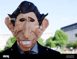 Prince charles mask hi-res stock photography and images