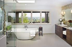 A large trendy modern rug is a great substitute for a few smaller ones and it offers an element of airiness to the bathroom. New Design For An Oddly Shaped Bath Strite Design Remodel