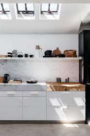 kitchen with skylights wood chopping board thick marble countertop and clean minimal style coco kell interior design kitchen kitchen interior kitchen design