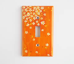 Orange And White Lightswitch Cover Handpainted Switchplates Daisy Design Painted Switchplates In 2020 Light Switch Covers Diy Decorative Light Switch Covers Light Switch Covers