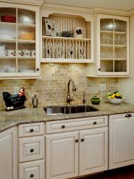 Opposite the white shaker cabinets is a large center island with dark brown flat panel cabinets and a. Ivory Cabinets Ideas On Foter