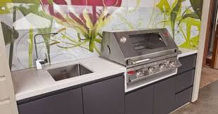 Modern Outdoor Kitchen Built In Bbq Area Using Weather Proof Board Beefeater Bbq Colourful Flora Outdoor Bbq Kitchen Outdoor Kitchen Modern Outdoor Kitchen