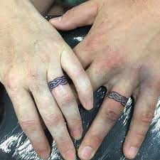 40 Awesome Wedding Band Ring Tattoos In 2020 Wedding Band Tattoo Tattoo Wedding Rings Ring Tattoo Designs