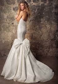 Then, tuck the back of the skirt up and under the dress, so you can attach the eye hook to the tie on the underside. Types Of Wedding Dress Bustles Styles Looksgud Com