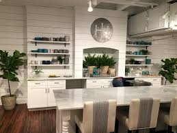 This beautiful white cabinet kitchen has painted white shiplap ceiling that flows in to the open living room and a gray shiplap kitchen island with quartz countertop. Painting Shiplap Siding Walls By Design