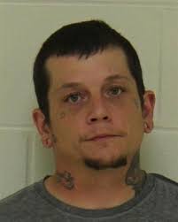 Kensett man accused of smashing truck with brick