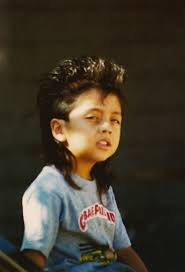 The hairstyle features a bit shorter hair on top that is styled with a cool side part. The Mullet Obvious Contender For The World S Worst Hairstyle Dangerous Minds