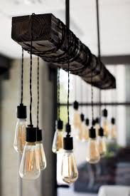 Edison's lamp would consist of a filament housed in a glass vacuum bulb. Edison Bulb Chandelier In This New Conference Room Farmhouse Lighting Dining Farmhouse Dining Room Lighting Dining Lighting