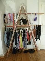 A garage or yard sale is a good way to raise money by selling the things you no longer use. Ladders Not Just Something To Stand On The Owner Builder Network Diy Coat Rack Diy Clothes Rack Yard Sale Clothes Rack