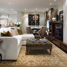 In the adjoining dining room, bottom, she continued the same balanced approach, surrounding a substantial rectangular table with six classic, upholstered chairs. Candice Olson Dining Rooms Design Ideas