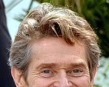 Image of Willem Dafoe with an award