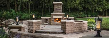 To build a backyard fire pit with bricks, start by digging a circular hole that's 4 feet in diameter and 12 inches deep. Retaining Walls Create Functional And Attractive Outdoor Seating Options Coastal Home Garden