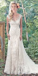 A Dozen Large Elaborate Floral Centerpieces Can Set A Bride Back Hundreds If Not Th Lace Wedding Dress Vintage Sottero Wedding Dress Wedding Dresses Romantic