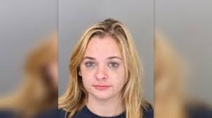 Woman accused of biting, hitting officer