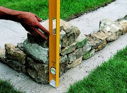 Because this base should not be visible, you will need to excavate soil to a depth of at least 4 inches. How To Build A Stone Garden Wall Ideas Advice Diy At B Q