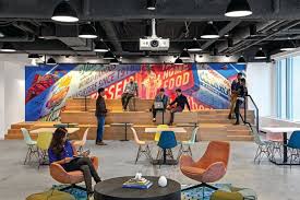 Booking Com Designs Nyc Themed Offices At 28 Liberty Commercial Observer In 2020 Woolworth Building Cool Office Bleacher Seating