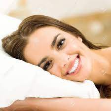 Note to audrey hepburn fans: Young Beautiful Happy Smiling Woman Waking Up On Bed Stock Photo Picture And Royalty Free Image Image 93324964