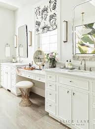 His And Her White Washstands Featuring A Drop Down Makeup Vanity Topped With White Marble Countertops Master Bathroom Vanity Bathroom Design Bathrooms Remodel