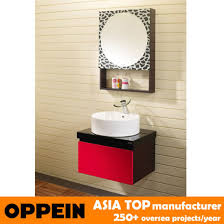 The thick stone top beautifully complements the sharp, clean lines of the cabinet. China Oppein Modern Cherry Red Oak Bathroom Vanity Cabinet Op P1130 China Bathroom Cabinet Bathroom Furniture