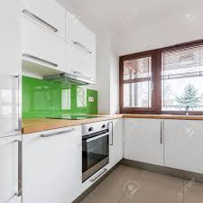 Check spelling or type a new query. White Kitchen With Modern Cupboards Beige Floor Tiles And Big Window Stock Photo Picture And Royalty Free Image Image 82724601