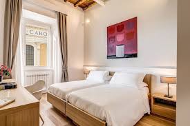 Camera matrimoniale/doppia con letti singoli dotata di isolamento acustico, pavimento piastrellato/in marmo e accappatoio. Matrimoniale Superior Doppia Con Letti Singoli Dopodomani Suite Boutique Hotel Sito Ufficiale