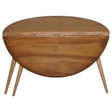 It has brass handles and on the bottom of the legs. Drop Leaf Coffee Tables 12 For Sale On 1stdibs