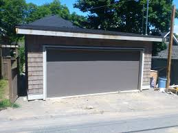 Clopay Classic Series Premium Insulated 1 3 8 Garage Door In Bronze Bronze Is The New Sandtone Of Ga Garage Doors Garage Door Panels Garage Door Insulation