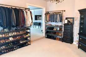 Carabiners make adjusting the height of the extra rod a snap. Diy Retail Clothing Racks Made With Pipe Simplified Building