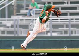 Miami Hurricanes 2B Frankie Ratcliff (19) avoids tag from 1B Ryan Durrence  (35). The 14th ranked Miami Hurricanes defeated the Bethune- Cookman  Wildcats 5-2 at Alex Rodriguez Park in Coral Gables, Florida. (