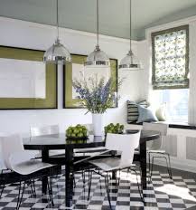 An elegant living room dominated by black and white where the white sofa set is paired with black throw pillows and the black wooden center table. Interesting Black And Green Color Combos Used In Interior Decor