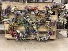 Hang the coat hanger in a warm dry closet or attic until the flowers are dry. Dried Flowers Are Back