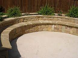 A daybed repurposed as a chaise, a banquette strewn with colorful pillows and cushions, a lounge suspended from the ceiling: Custom Bench Seating Semi Circle Stone Bench Stone Patio Designs Patio Stones Outdoor Stone