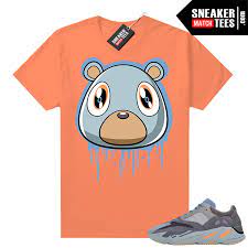 That magic in the air is a 15% off sitewide sale. Carbon Blue Yeezy 700 Shirt Bright Orange Bear Drip Yeezy Match Tees