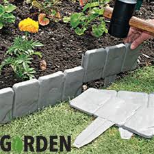 It can be cut to size and is flexible. Buy Cobbled Stone Effect Lawn Edging 10 Pack At Home Bargains Garden Lawn Edging Garden Edging Ideas Cheap Cheap Landscaping Ideas