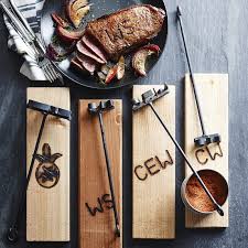 The above as well as a branded wood steak plate. Monogrammed Forged Steak Brand Williams Sonoma