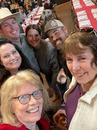 Volunteers create 205 Christmas food baskets for families