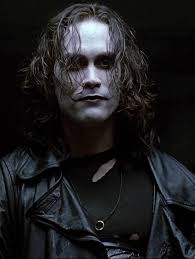 In The Crow just before Eric paints his face, he is sitting at the dresser  looking at memories of his life with Shelly, he pulls some pictures out of  a drawer and