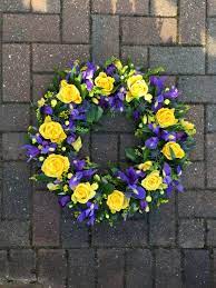 Casket spray flowers and floral arrangements for the funeral service are normally chosen by the immediate family of the yellow and white mix flowers in wellington. Yellow And Purple Blue Funeral Tribute Wreath Of Roses Freesias Iris Lisianthus And Thistle Blue Flower Arrangements Funeral Floral Flower Wreath Funeral