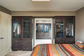 We cannot imagine bedroom without wardrobe.there are a variety forms of bedroom wardrobe such as wood designs to look more classy and aluminum to be modern, and sometimes we see from glass to be unique and fashionable. Master Bedroom Ensuite And Walk In Closet Transitional Wardrobe Calgary By Kon Strux Developments Houzz