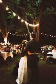 Cozy And Romantic Backyard Wedding Decor With Hanging Lights Backyard Wedding Wedding Mix Affordable Wedding