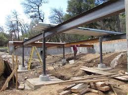 Borrowing From The Commercial Building World We Use Steel To Prep For An Elevated Concrete Slab Steel House Steel Frame House Steel Deck Framing