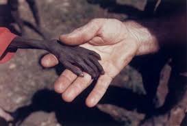 This Example Of Emotive Imagery Is Of Child In Uganda Holding Hands With A Missionary The Stark Contrast Between Powerful Images Powerful Pictures World Press