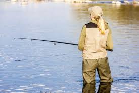 Omagecollections with woman wearing waders and fishinggear. Best Fishing Waders For Women In 2021