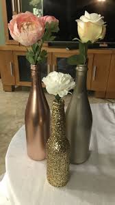 Lighted wine bottles bottle lights glass bottles water bottles wedding wine bottles diy wedding decorations wedding centerpieces wedding ideas floral centrepieces. Wine Bottle Centerpiece Diy Winebottle Centerpiece Flowers Bridalshowerideas Wine Bottle Centerpieces Spray Painted Wine Bottles Wine Glass Centerpieces