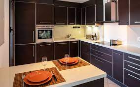 The wardrobes are kept in natural wood color and walls are kept white. Modern Kitchen Designs In Pakistan Types Features Zameen Blog